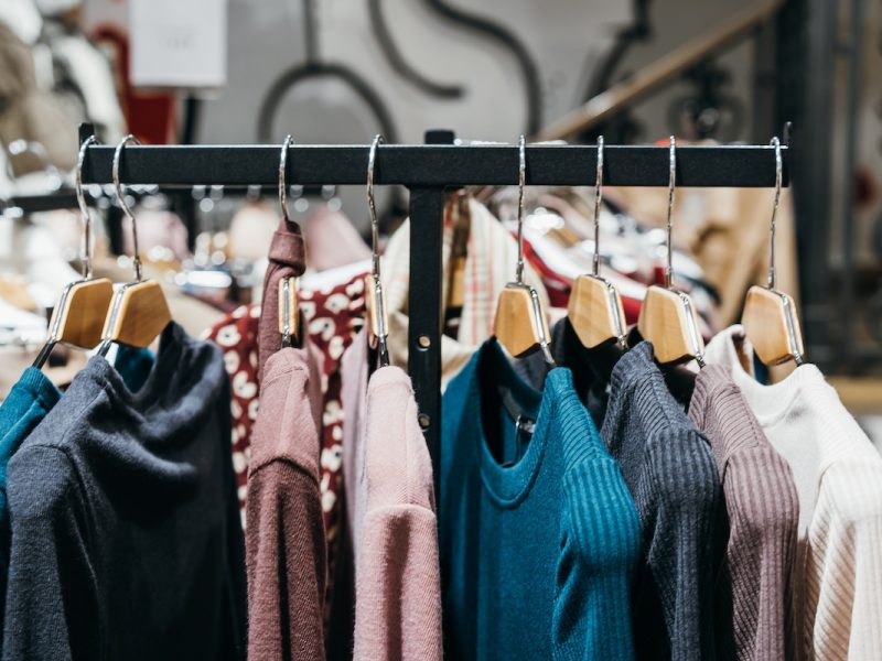 fashion clothing on hangers at the show